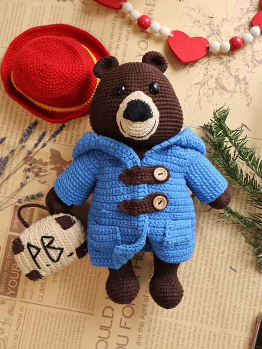 Chubby brown bear with a red hat